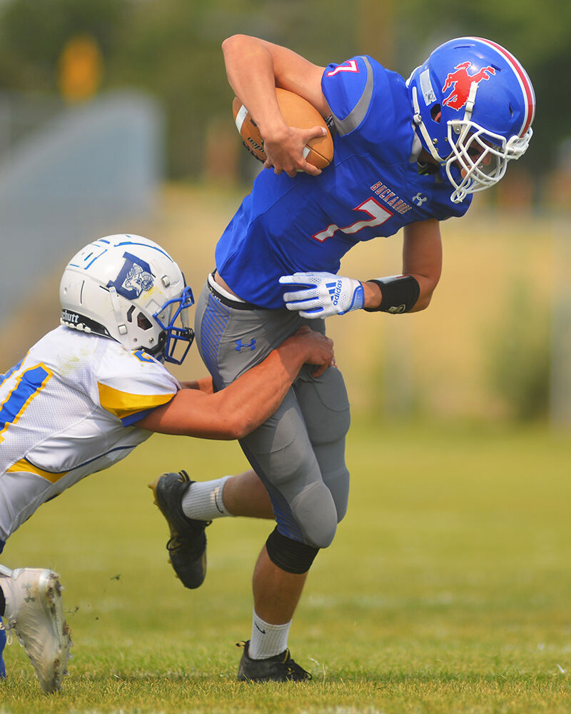 Harley Davis pulls through a tackle to move downfield during the first quarter